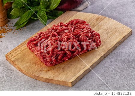 Raw minced beef meat over board Raw minced beef meat over board 134852122