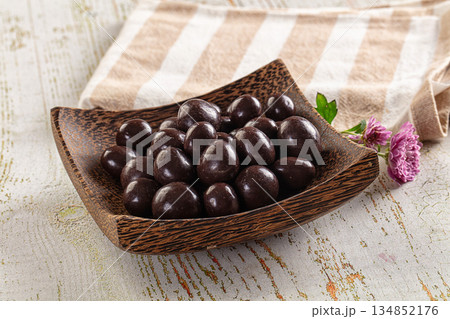 Nut in chocolate balls sweet candy 134852176