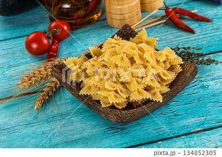 Raw dry farfalle for cooking 134852305