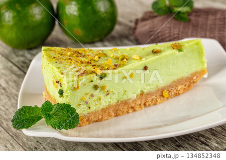 Green pistachio cheesecake served mint Green pistachio cheesecake served mint 134852348