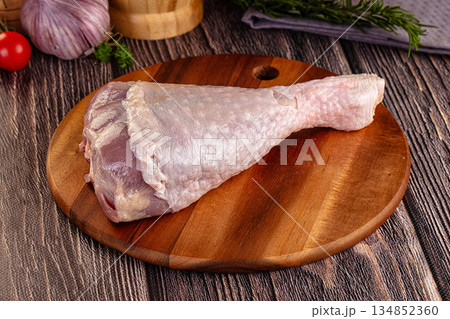 Raw turkey drumstick leg over board Raw turkey drumstick leg over board 134852360