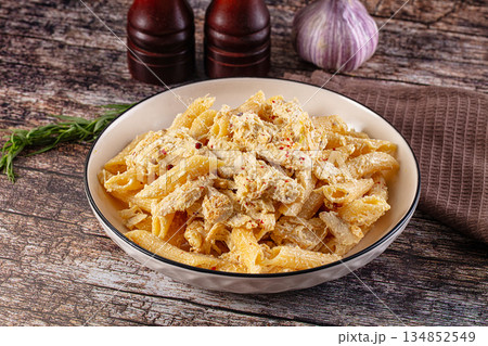 Creamy pasta Alfredo with chicken 134852549
