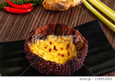 Baked sea urchin with cheese and egg Baked sea urchin with cheese and egg 134852605