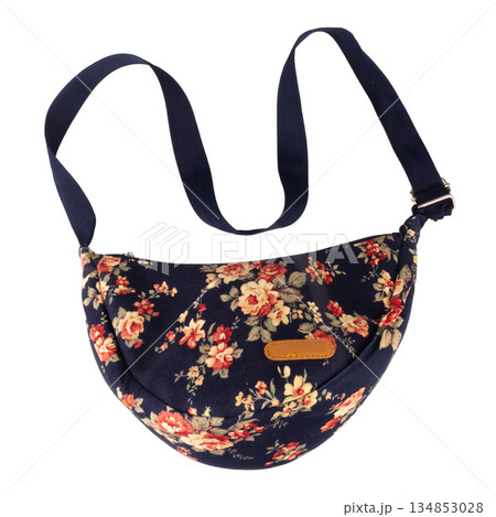 Navy blue floral patterned bag isolated on white background Navy blue floral patterned bag isolated on white background 134853028