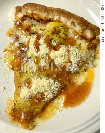 Delicious slice of pizza with a crispy crust, gooey melted cheese, and flavorful toppings. Perfect for a quick snack, party treat, or satisfying meal. Irresistibly cheesy and full of flavor! 134853485