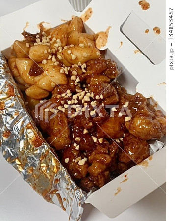 Crispy Korean fried chicken, perfectly glazed with a sweet and spicy sauce. Ideal for food photography and menus, showcasing the irresistible crunch and flavor of this beloved dish. Crispy Korean fried chicken, perfectly glazed with a sweet and spicy sauce. Ideal for food photography and menus, showcasing the irresistible crunch and flavor of this beloved dish. 134853487