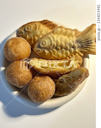 Bungeoppang, bungeo-ppang (Korean Fish Shaped Pastry), popular snack, cookies, sweet in winter streets of Korea. Bungeoppang Korean traditional national food, dish, cuisine. Japanese taiyaki Bungeoppang, bungeo-ppang (Korean Fish Shaped Pastry), popular snack, cookies, sweet in winter streets of Korea. Bungeoppang Korean traditional national food, dish, cuisine. Japanese taiyaki 134853491