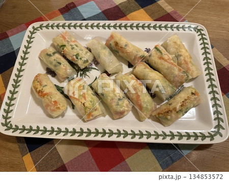 Korean dumplings filled with a mix of savory ingredients like ground meat, tofu, and vegetables. Mandu can be steamed, boiled, or pan-fried, making it a versatile and delicious snack or meal. 134853572