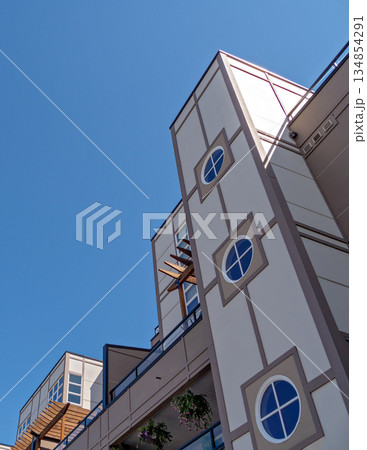 Top of residential building on blue sky background Top of residential building on blue sky background 134854291