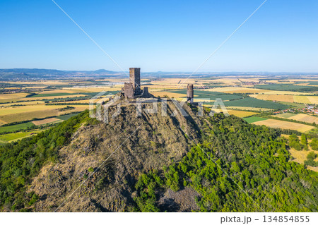 Hazmburk Castle ruins stand majestically atop a hill in Czechia. Hazmburk Castle ruins stand majestically atop a hill in Czechia. 134854855