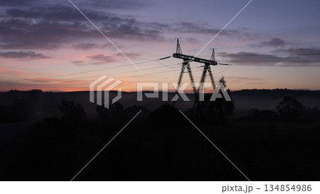 tower line, Grid countryside, Tower technology. Power lines stretched across landscape, linking together steel towers and pylons needed for electricity transmission. tower line, Grid countryside, Tower technology. Power lines stretched across landscape, linking together steel towers and pylons needed for electricity transmission. 134854986