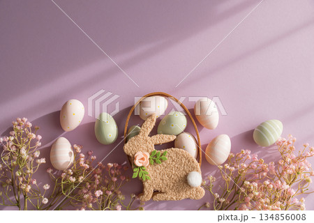 Pastel Easter Bunny Basket with Eggs and Flowers on Lavender Background Pastel Easter Bunny Basket with Eggs and Flowers on Lavender Background 134856008