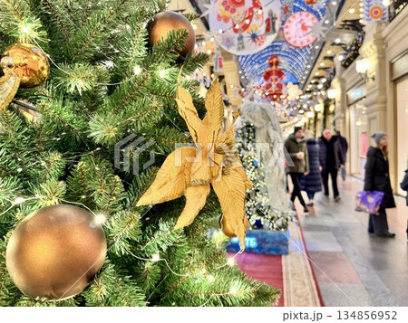 Bright Christmas Tree toys are hanging on the tree. New Year 134856952