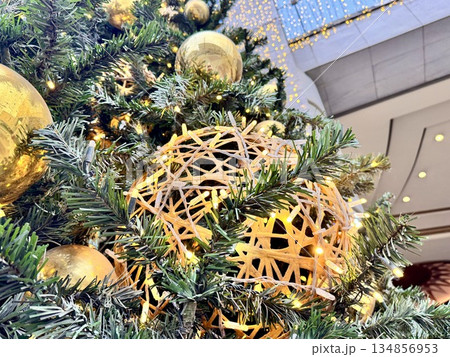 Bright Christmas Tree toys are hanging on the tree. New Year 134856953