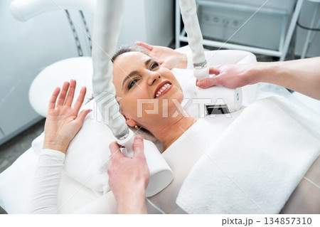 Woman receiving a beauty treatment in a modern wellness center 134857310