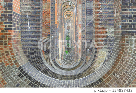 Architectural splendour of Ouse Valley Viaduct or Balcombe Viaduct (Railway viaduct) carries the Brighton Main Line over the River Ouse in Sussex. The semi-circular arches vaulting supporting brick 134857432