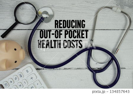 Reducing Out-of-Pocket Health Costs text with Stethoscope and magnifying glass on wooden background 134857643