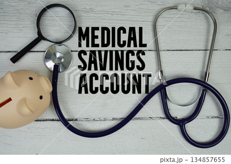 Medical Savings Account (MSA) text with Stethoscope and magnifying glass on wooden background Medical Savings Account (MSA) text with Stethoscope and magnifying glass on wooden background 134857655