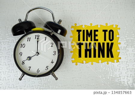 Time To Think text with alarm clock on yellow background Time To Think text with alarm clock on yellow background 134857663