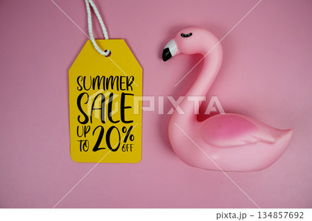 Price tag Sale 20% with pink flamingo summer decorations on pink background 134857692