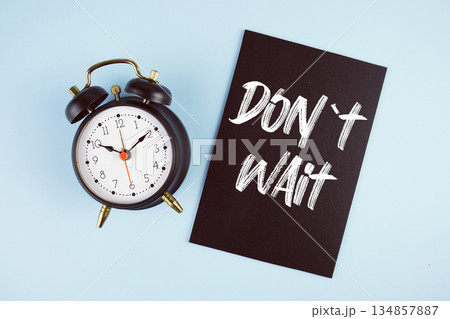 Don't Wait text with alarm clock on blue background 134857887