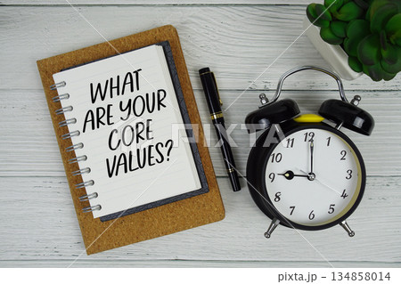 What Are Your Core Values? text written on notepad with alarm clock on wooden background What Are Your Core Values? text written on notepad with alarm clock on wooden background 134858014