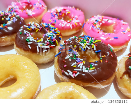 Variety of delicious glazed and frosted donuts 134858112
