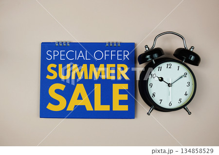 Special Offer Summer Sale text with alarm clock on pink background 134858529
