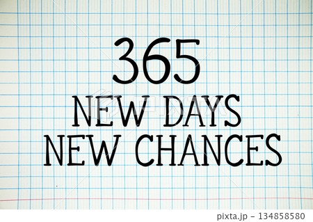 365 New Days New Chances text written on white notebook sheet with grid 365 New Days New Chances text written on white notebook sheet with grid 134858580