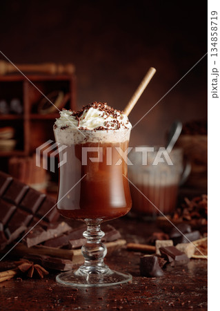 Hot chocolate topped with whipped cream and sprinkled with chocolate chips. Hot chocolate topped with whipped cream and sprinkled with chocolate chips. 134858719