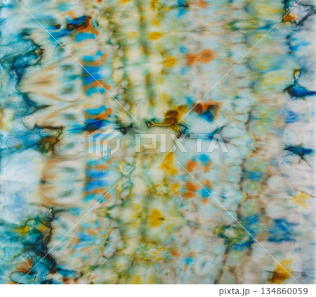 abstract pattern on silk fabric texture in blue, yellow, green colors abstract pattern on silk fabric texture in blue, yellow, green colors 134860059