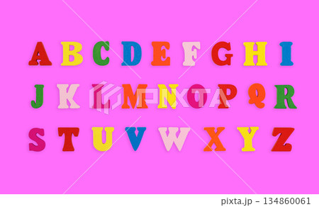 wooden letters of the English alphabet multi-colored on a pink background wooden letters of the English alphabet multi-colored on a pink background 134860061
