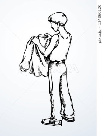 Vector drawing. The boy is picking up his shirt Vector drawing. The boy is picking up his shirt 134860120