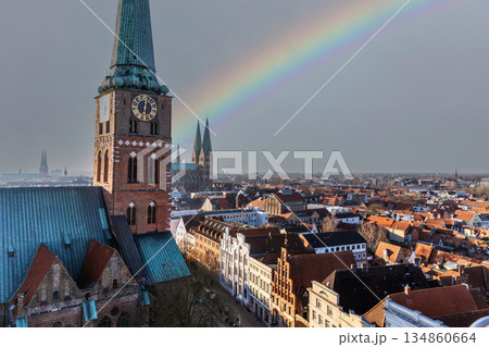 Rainbow over Lubeck Germany aerial view of historic city. Rainbow over Lubeck Germany aerial view of historic city. 134860664