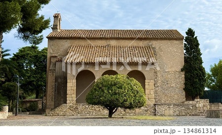 Historic Stone Church with Mediterranean Architecture and Clay Tile Roof 134861314