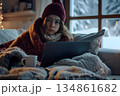 sick young woman feeling cold wrapped in a blanket 134861682