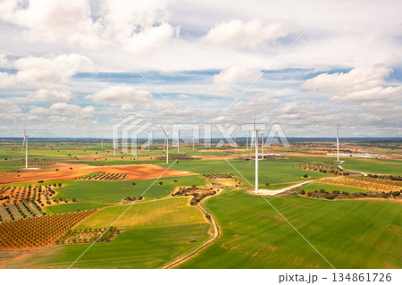Wind turbines across open countryside under cloudy 134861726