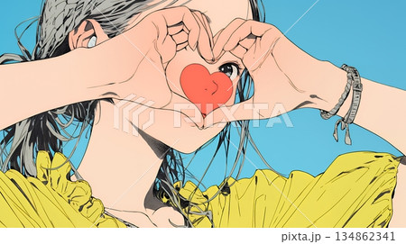 ハートマークを手で作り愛情表現をしている若い女性