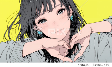 ハートマークを手で作り愛情表現をしている若い女性