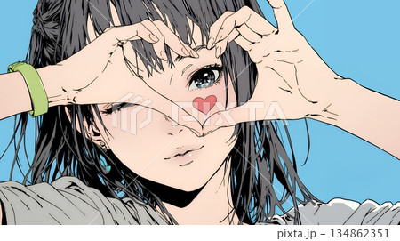 ハートマークを手で作り愛情表現をしている若い女性