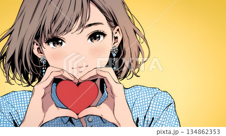 ハートマークを手で作り愛情表現をしている若い女性