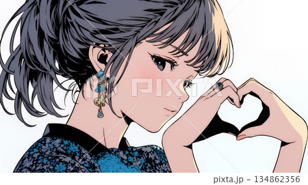 ハートマークを手で作り愛情表現をしている若い女性