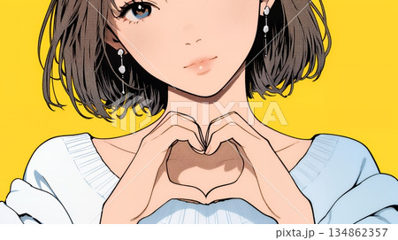 ハートマークを手で作り愛情表現をしている若い女性