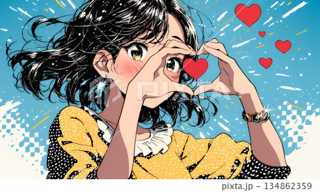 ハートマークを手で作り愛情表現をしている若い女性