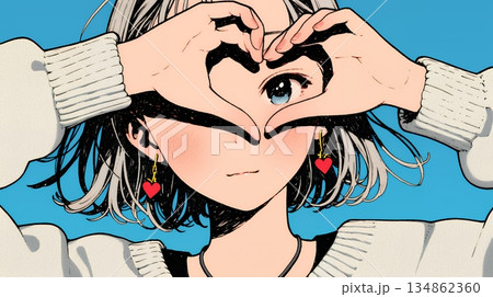 ハートマークを手で作り愛情表現をしている若い女性