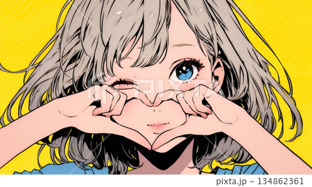 ハートマークを手で作り愛情表現をしている若い女性