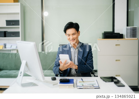 Man freelancer is working her job on computer tablet and laptop Doing accounting analysis report real estate 134865021