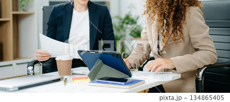 Team work process. Photo young business crew working with new startup project. Project managers meeting. 134865405