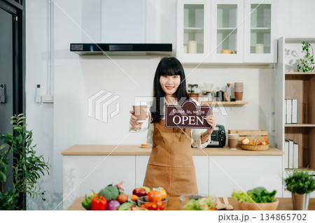 Startup successful small business owner sme woman stand with tablet  in cafe restaurant. 134865702