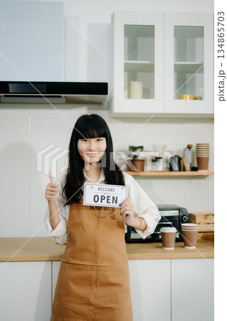 Startup successful small business owner sme woman stand with tablet in cafe restaurant. Startup successful small business owner sme woman stand with tablet in cafe restaurant. 134865703